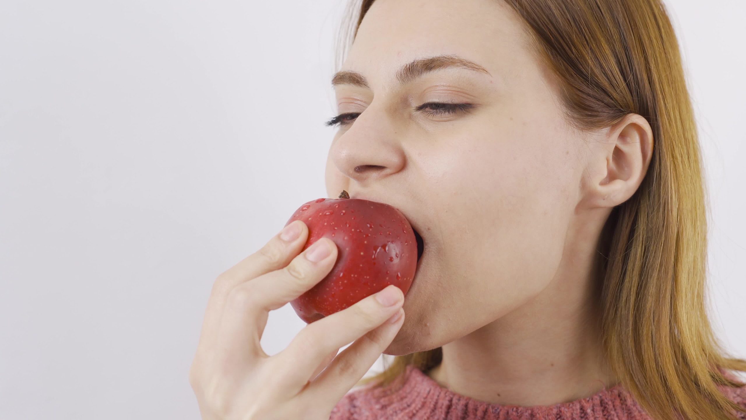 Woman Eating An Apple