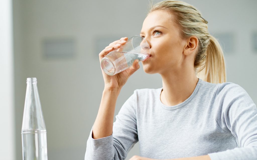 Woman Sipping on Water